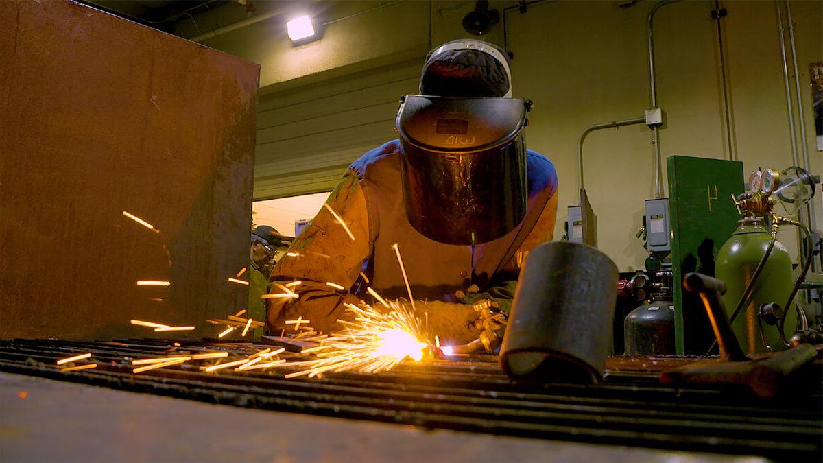 A student works on a welding project